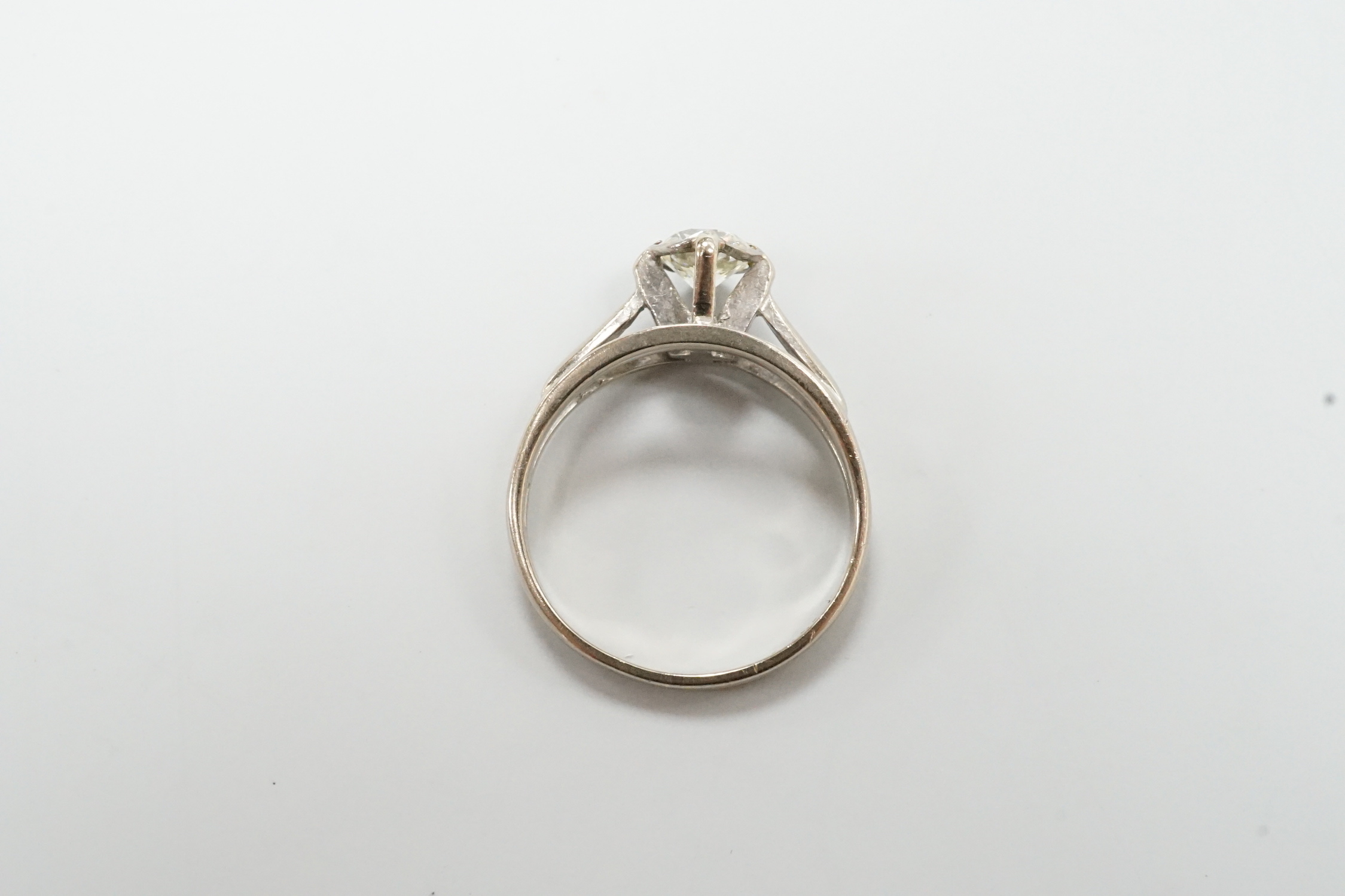 A modern 18ct white gold and solitaire diamond ring, size N, gross weight 3.7 grams.